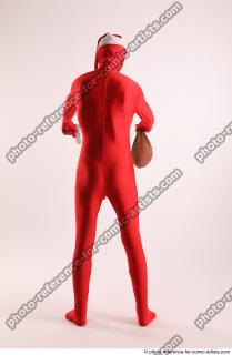 JOEL_ADAMSON CHRISTMAS VALLAIN WITH GUN AND BAG